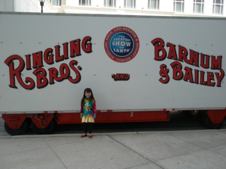 Kasen standing by the circus truck